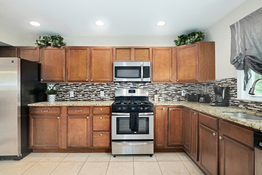 Updated full kitchen with stainless steel appliances at Hi Nella Sober Living Home for Men