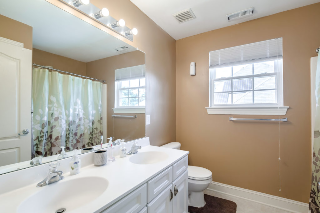 bathroom with dual vanity and shower at Blackwood Sober Living Home for Women