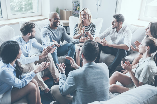 charateristics to look for in a sober living home charateristics to look for in a sober living home people sitting in a therapy circle applauding a fellow patient