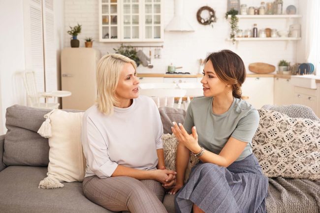 does my loved one need sober living two women on couch discussing does my loved one need sober living